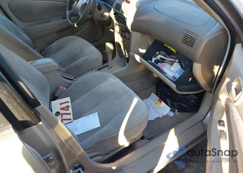 2001 Toyota Corolla Le from USA, damaged, VIN 2T1BR12E41C428657